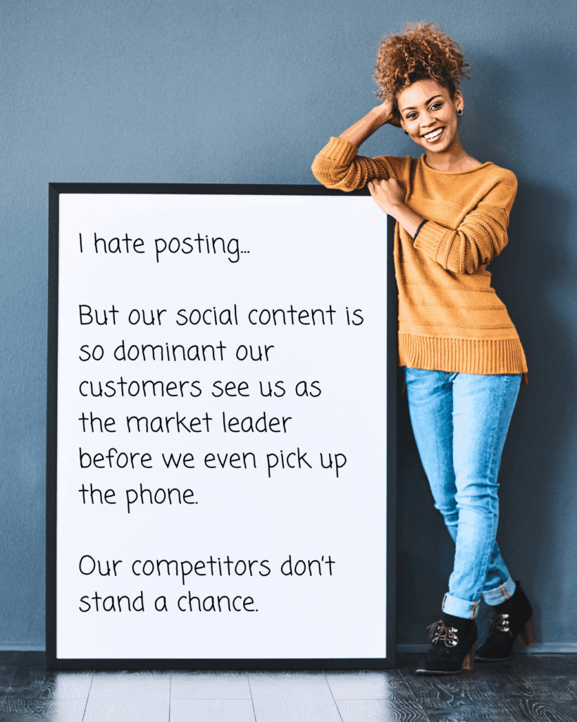 Smiling woman leaning on a large sign expressing confidence in content dominance despite disliking social media posting